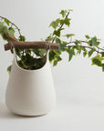 Handmade Porcelain Vase with Wooden Detail – White Smooth Surface (15×20 cm.)